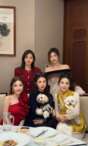 She is the one in the red half shoulder blouse