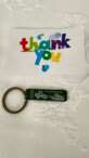 The keychain and a card thanking me for making the purchase.