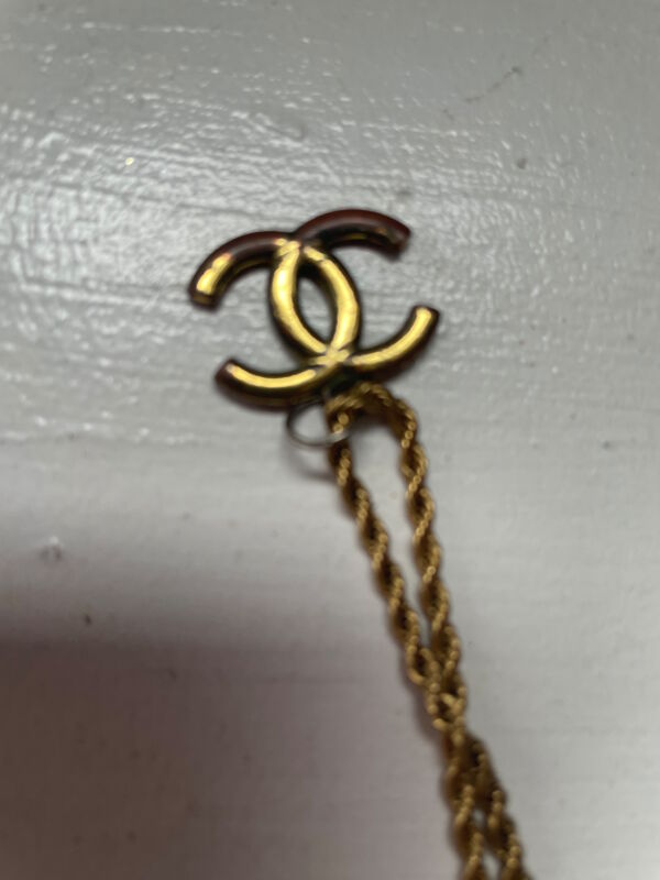 Is this real? I ordered this gold Chanel chain from grailed.com and the  chain says it is 18k good I am doubting the authenticity of the CC pendant.  Can anyone help me